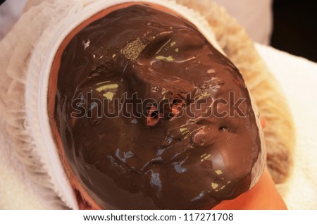 Closeup of Chocolate mask at woman face