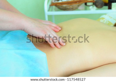 Closeup photo of massage of female back