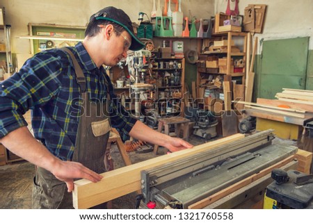 Carpenter planed wooden block with electric machine