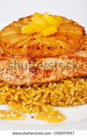 chicken fillet baked with pineapple, with rice and salad