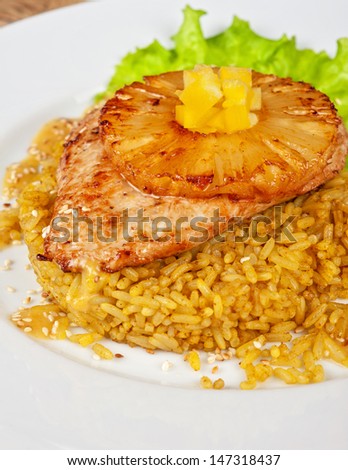 chicken fillet baked with pineapple, with rice and salad