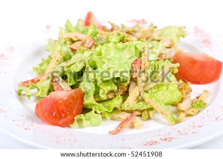 Salad of squid with roast chiÑ�ken meat, apples, tomatoes, eggs and peppers