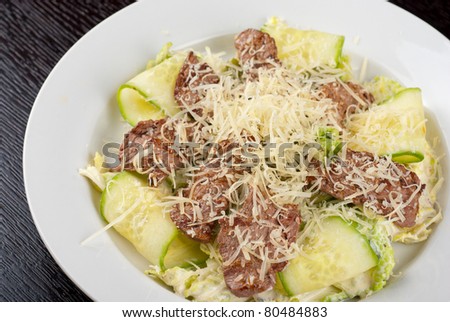 Salad with beef, lettuce, cucumber, string beans, Chinese cabbage and sauce