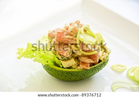 Fresh salad with shrimps, salmon and avocado