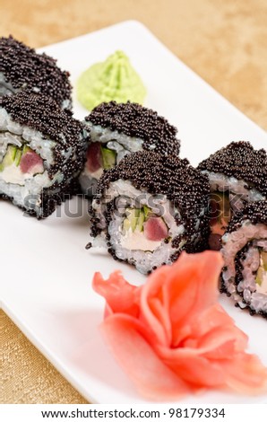 sushi roll with tuna, avacado, sauce and flying fish roe