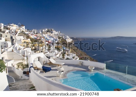 stock photo Romantic pool overlooking Santorini Greece