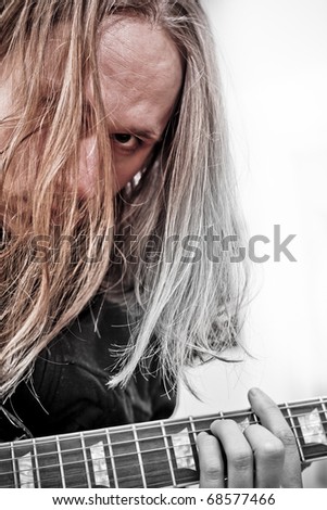 Guitar player with long blonde hair