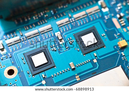 Printed circuit board with two microchips which are most likely caching or memory chips for the main processor