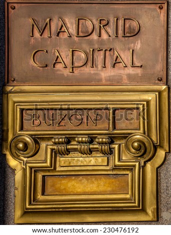 Copper and golden  colored Post office box in Madrid in Spain