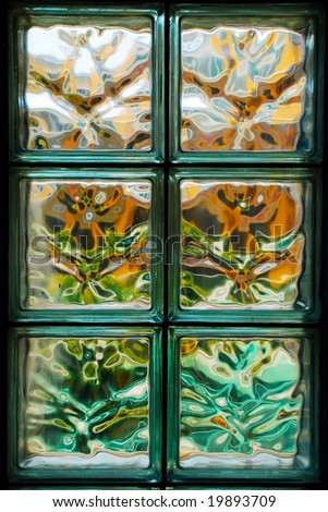Closeup of glass blocks on office wall with colorful pattern