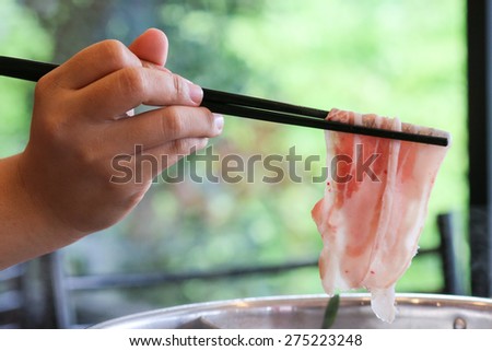 hand pick chopsticks, eating japan food, fresh pork.