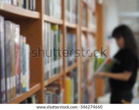 blurred bookshelf and student  in library room, education zone