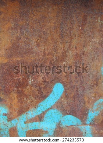 rusty metal surface with blue paint lines