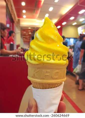 BANGKOK - MARCH 15, 2015 : Photo of jelly mango soft cone ice cream available only in summer promotion, KFC Thailand [during 10 March 2015 - 21 April 2015 or until product is out of stock]