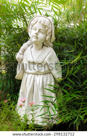 Classic Sculpture of Little Girl, Standing in the garden, Soft and Dreamy Effect