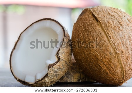 Whole and broken coconut on the table