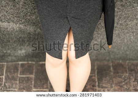 Sitting business woman\'s legs