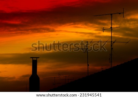 Roof Antennas Silhouette at Sunset