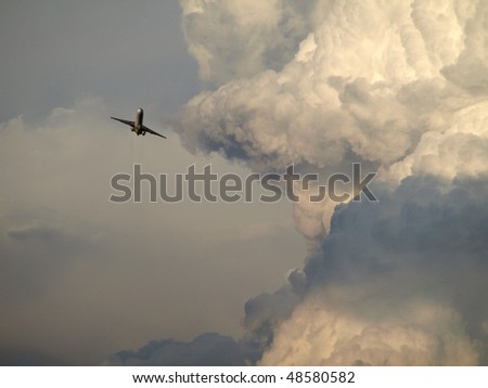 airplane flying close to the storm