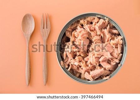 canned tuna isolated on orange background / Canned soy free albacore white meat tuna packed in water / open tuna tin on a white background / tuna fish isolated on white