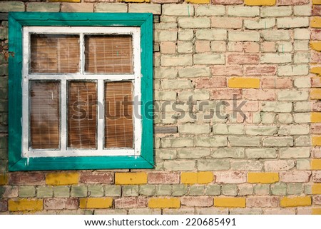 window frame in the brick wall of an old house