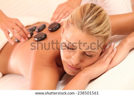 woman relax while the hot stone massage