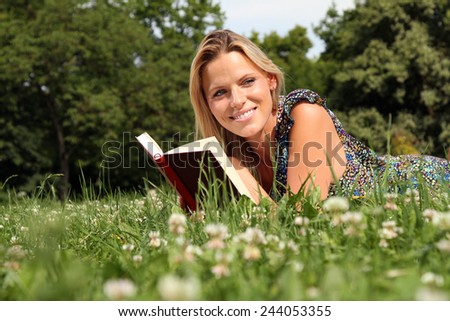 woman reading a book outside