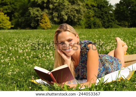 woman reading a book outside