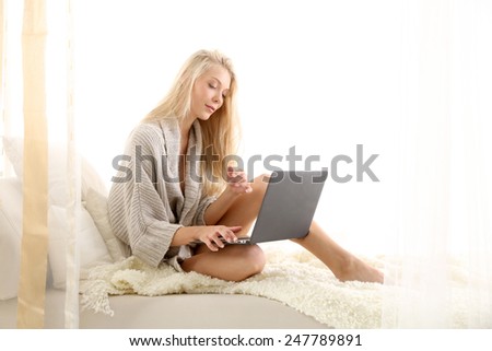 young woman searching something in the internet