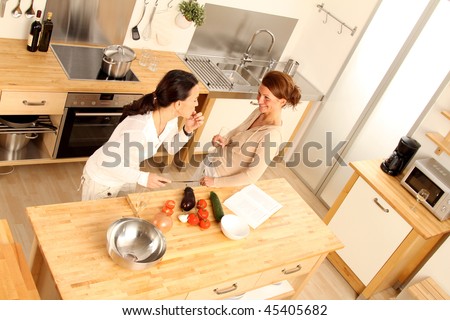 Two women in the kitchen from a bird\'s point of view
