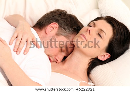 a man is sleeping on his wife