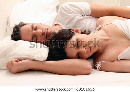 sleeping couple in bed