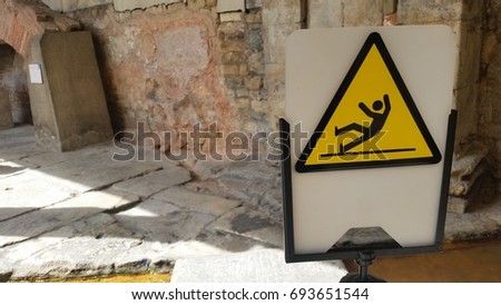 Warning Sign for Slippery floor with soft focus background