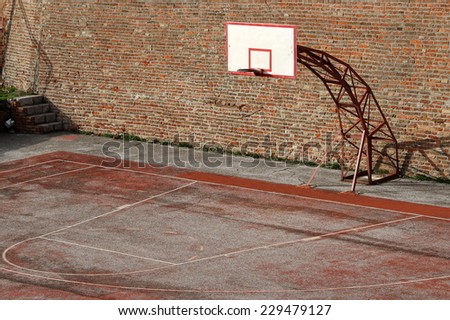 Basketball court with brick wall background