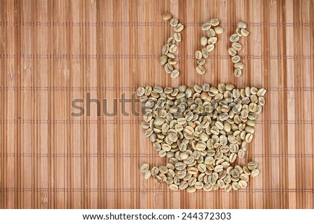 Raw coffee beans shaped like  cup of coffee