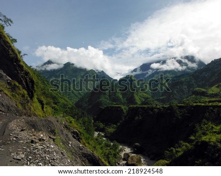 The green lower Himalayan mountains during monsoon time around the Annapurna Area village of Tatopani.