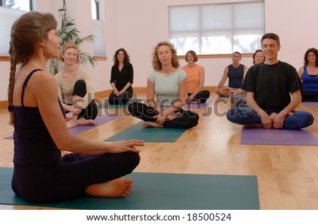 Yoga instructor and students