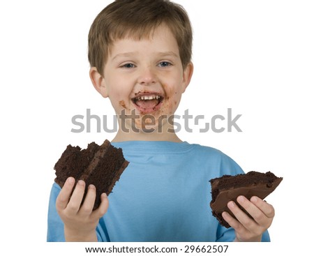 Boy with cake makes a mess while eating