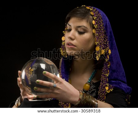 Gypsy fortune-teller uses a crystal ball to foertell the future