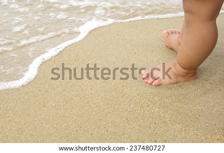 Baby feet walking  foot on the beach