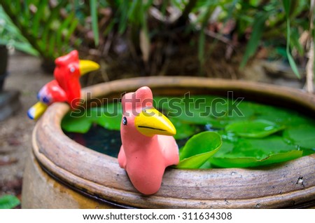 colorful sculpture bird in garden