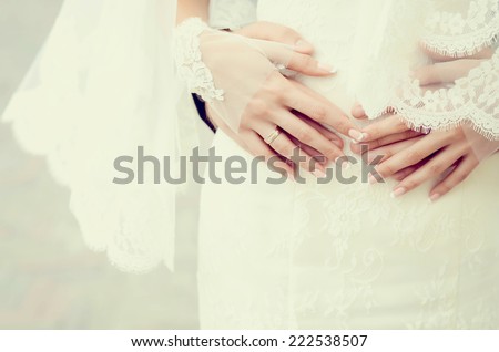 wedding theme, holding hands newlyweds with golden rings
