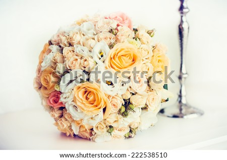 wedding bridal bouquet with white, peach and orange roses