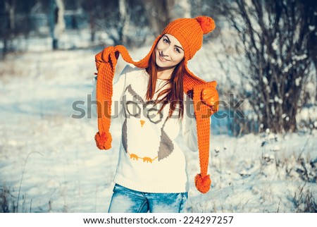 Young beautiful girl are in the winter forest. winter theme