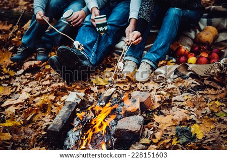 couple camping in the autumn forest. Fall background