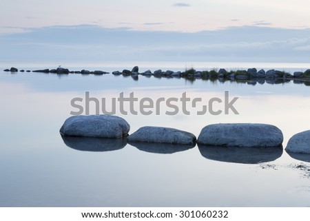 Breakwater Rocks in Calm Sea