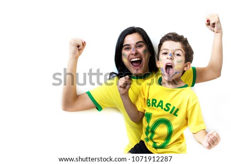 Brazilian family cheering together. Fans celebrating over white background. Painted faces and cheering