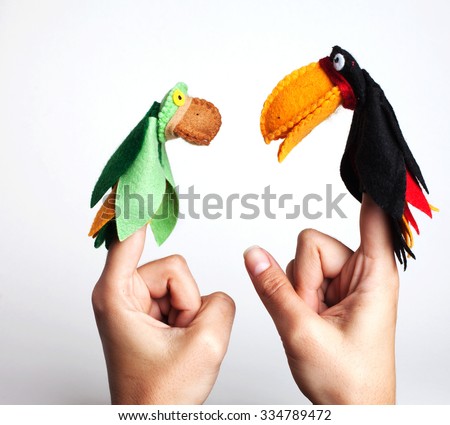 Brazilian animals  (toucan and parrot) puppets in the fingers.