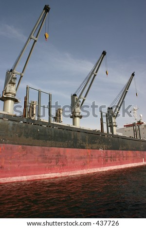 Cranes on a container ship reddy to load cargo