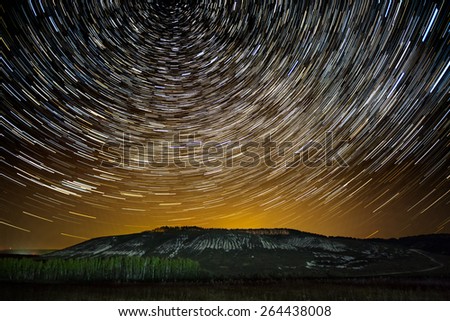 Impressive star tracks above Stenk-Izgorya protected area chalk hills in Belgorod region, southern Russia